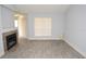 Bright living room featuring a fireplace, light-gray walls, and modern vinyl flooring at 8659 Fancy Finch Dr # 202, Tampa, FL 33614