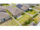 An aerial view of a backyard with a stone patio and lawn at 9313 Channing Hill Dr, Ruskin, FL 33573
