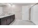 Bathroom featuring double sinks, ample counter space, and shower/tub combo at 9313 Channing Hill Dr, Ruskin, FL 33573