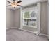 Serene bedroom with plush carpet, ceiling fan, and window views at 9313 Channing Hill Dr, Ruskin, FL 33573