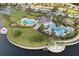 Aerial view of community pool area with multiple pools, seating, and landscaping at 9313 Channing Hill Dr, Ruskin, FL 33573