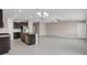 Open-concept living space features recessed lighting, ceiling fan, and flows into a modern kitchen with island at 9313 Channing Hill Dr, Ruskin, FL 33573