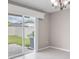 Bright and airy living space featuring tile floors, sliding glass doors with access to the backyard at 9313 Channing Hill Dr, Ruskin, FL 33573