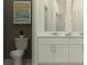 Bathroom with double vanity, white countertops, and contemporary fixtures at 9352 Bonita Mar Dr, Parrish, FL 34219