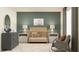 Bedroom with modern décor featuring a wooden crib, gray dresser, and patterned area rug at 9352 Bonita Mar Dr, Parrish, FL 34219