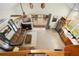 Bright living room featuring a modern fireplace, ceiling fan, deck access and decor at 13381 Glory Ln, Brooksville, FL 34614