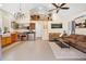 Open concept living space with kitchen, living room, and loft with ladder access at 13381 Glory Ln, Brooksville, FL 34614