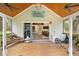 Spacious screened porch with seating, ceiling fan, and access to the indoor living spaces at 13381 Glory Ln, Brooksville, FL 34614