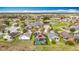 Aerial view of the home with a screened-in pool and backyard at 13422 Niti Dr, Hudson, FL 34669