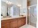 Bathroom featuring granite countertops, and a walk-in shower at 13422 Niti Dr, Hudson, FL 34669
