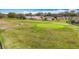 Golf course view featuring manicured green, fairway and community homes at 13422 Niti Dr, Hudson, FL 34669