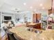 Open kitchen with granite countertops and stainless steel appliances overlooks the living area at 13422 Niti Dr, Hudson, FL 34669