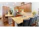 Gourmet kitchen featuring wood cabinets, granite countertops, and a center island with seating at 13422 Niti Dr, Hudson, FL 34669