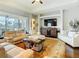 Bright living room with large-screen TV and plush seating at 13422 Niti Dr, Hudson, FL 34669