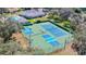 Aerial view of community tennis courts and pool at 13422 Niti Dr, Hudson, FL 34669