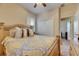 Bedroom featuring a bed with patterned bedspread and a large window at 13454 Graham Yarden Dr, Riverview, FL 33579