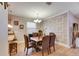 Charming dining area with stylish decor, adjacent open kitchen, and lots of natural light at 13454 Graham Yarden Dr, Riverview, FL 33579