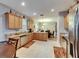 Spacious kitchen features granite countertops, stainless steel appliances, wood cabinetry, and tiled flooring at 13454 Graham Yarden Dr, Riverview, FL 33579