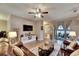 Comfortable living room with a ceiling fan, and sliding glass doors leading to an outdoor patio at 13454 Graham Yarden Dr, Riverview, FL 33579