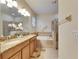 Main bathroom features double sinks, a soaking tub, and a separate glass shower enclosure at 13454 Graham Yarden Dr, Riverview, FL 33579