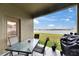 View of a covered patio area with outdoor seating, a barbecue grill, and a lake view at 13454 Graham Yarden Dr, Riverview, FL 33579