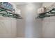 Walk-in closet with white wire shelving provides ample storage space at 1400 Gandy N Blvd # 806, St Petersburg, FL 33702