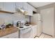 Efficient kitchen design featuring white cabinetry, modern appliances, and a well-lit workspace at 1400 Gandy N Blvd # 806, St Petersburg, FL 33702