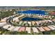 Scenic aerial view of homes nestled around a picturesque lake, featuring lush landscaping at 16023 Golden Lakes Dr, Wimauma, FL 33598