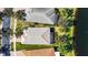 This aerial view displays a well-maintained community with lakefront properties and lush landscaping at 16023 Golden Lakes Dr, Wimauma, FL 33598