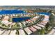 Aerial view of lakeside homes with mature landscaping, blue lakes and well-maintained streets at 16023 Golden Lakes Dr, Wimauma, FL 33598