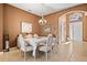 A cozy dining room set with beautiful furnishings and decor at 16023 Golden Lakes Dr, Wimauma, FL 33598