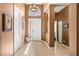 Foyer with high ceilings, tiled floors, a chandelier, and a view into the house at 16023 Golden Lakes Dr, Wimauma, FL 33598
