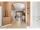 Hallway showcasing neutral walls and floors, with an archway leading to the dining and living rooms at 16023 Golden Lakes Dr, Wimauma, FL 33598