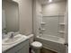 Bathroom featuring vanity with marble countertop and shower with tub at 17048 James Trl, Parrish, FL 34219