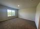 Neutral bedroom with carpet and a window with blinds at 17048 James Trl, Parrish, FL 34219