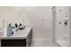 Clean and modern bathroom with double vanity sinks and a walk-in shower at 17056 James Trl, Parrish, FL 34219