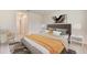 Cozy bedroom with a plush bed, neutral decor, and ample natural light at 17056 James Trl, Parrish, FL 34219