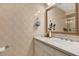 Bathroom featuring neutral tiling, a granite countertop, and updated fixtures at 1712 Long Bow Ln, Clearwater, FL 33764