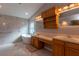 Primary bathroom with soaking tub, tile floor, vanity and sinks at 17508 Isbell Ln, Odessa, FL 33556