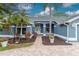 Inviting home exterior with a brick pathway leading to the front door and lush landscaping at 17508 Isbell Ln, Odessa, FL 33556