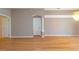 Spacious living room with natural hardwood floors at 17508 Isbell Ln, Odessa, FL 33556