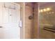 Beautiful shower stall with decorative tile, a clear glass door, and wall-mounted hardware at 17508 Isbell Ln, Odessa, FL 33556