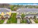 Aerial view of townhomes showing landscaping, garages, and neighborhood at 20462 Needletree Dr, Tampa, FL 33647