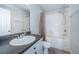 Bathroom with white tiling, granite vanity, and shower and bath tub combo at 2138 Chianti Pl # 142, Palm Harbor, FL 34683
