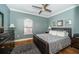 Bedroom with a large window, stylish furniture, and plenty of natural light at 2138 Chianti Pl # 142, Palm Harbor, FL 34683