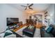 Open-concept living room and dining room area with wood floors and lots of natural light at 2138 Chianti Pl # 142, Palm Harbor, FL 34683