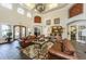 Bright lounge area with high ceilings, elegant decor, comfortable seating, and tile flooring at 2138 Chianti Pl # 142, Palm Harbor, FL 34683