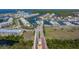 Stunning aerial view of the community with picturesque waterways, lush landscaping, and beautiful homes at 2630 Yellow Sundial Loop, Ruskin, FL 33570