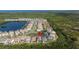 Aerial view of waterfront community and houses in a scenic neighborhood with mature landscaping at 2630 Yellow Sundial Loop, Ruskin, FL 33570