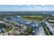 Aerial view of community houses, Little Harbor marina and the surrounding Florida landscape on a bright day at 2630 Yellow Sundial Loop, Ruskin, FL 33570